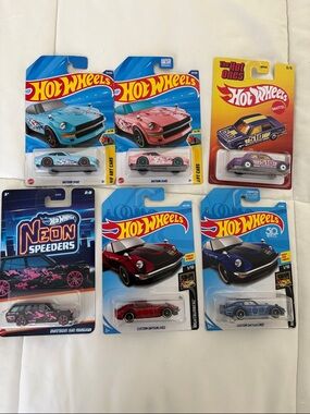 6 Assorted Datsun vehicles - Blue, Pink, Red, Purple